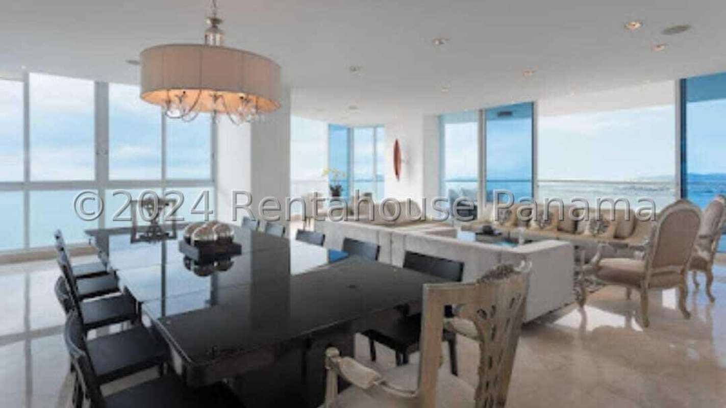 Luxury living room with floor-to-ceiling glass and ocean view in PH Pacific Point Panama City