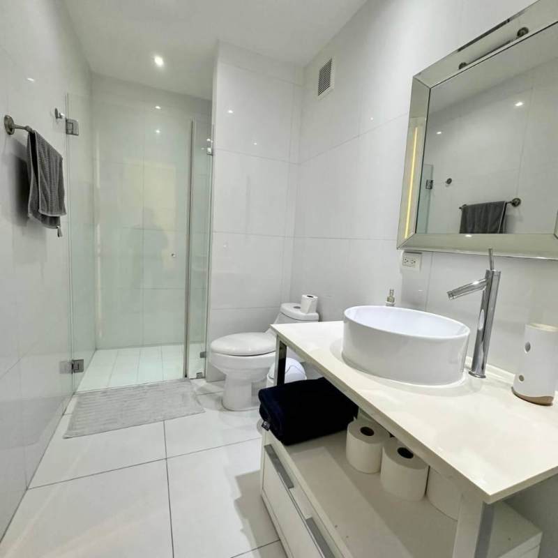 Luxurious master suite with floor-to-ceiling windows and ocean view balcony at PH Yoo Panama