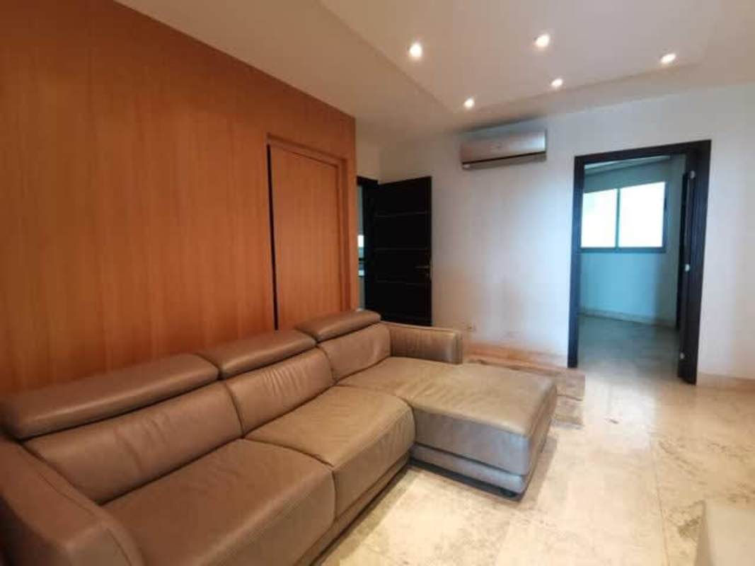 Contemporary kitchen featuring stainless appliances, black countertops at PH Bellagio in Bella Vista Panama City