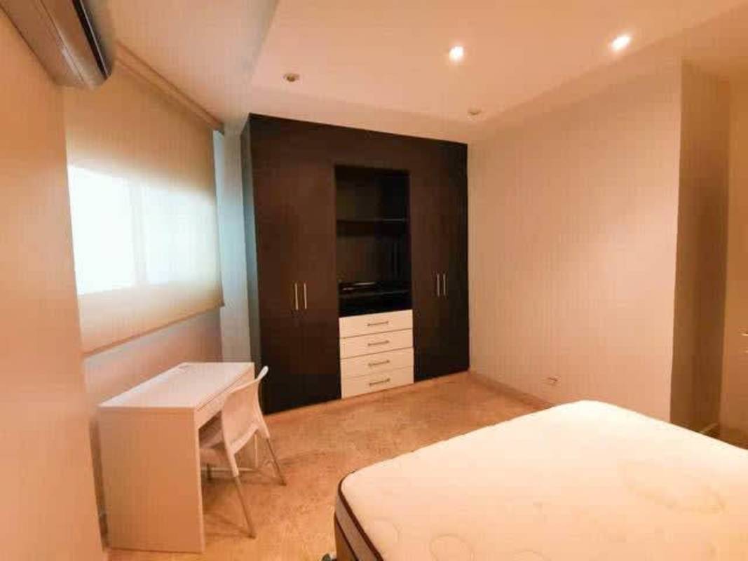 Master bathroom with double sinks, glass-enclosed shower at PH Bellagio Bella Vista Panama City