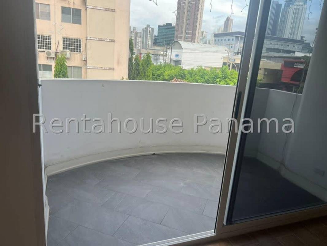 Apartment balcony with city skyline view and curved wall at PH Costa del Este Gardens Panama