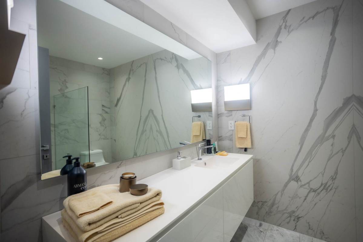 Luxury living space with floor-to-ceiling windows and ocean views at Nuovo by Armani Panama City