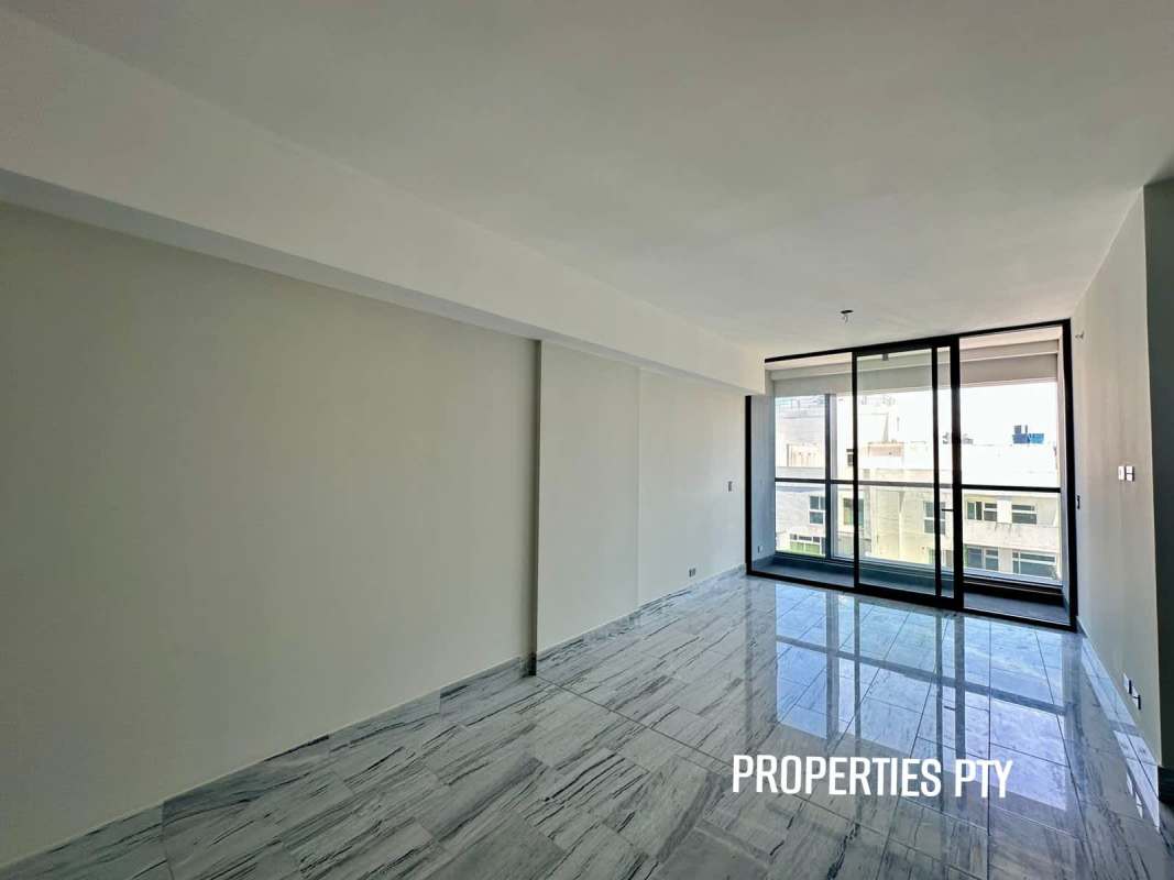 Modern apartment living room with panoramic windows, marble floors, balcony, city view in Nuovo by Armani