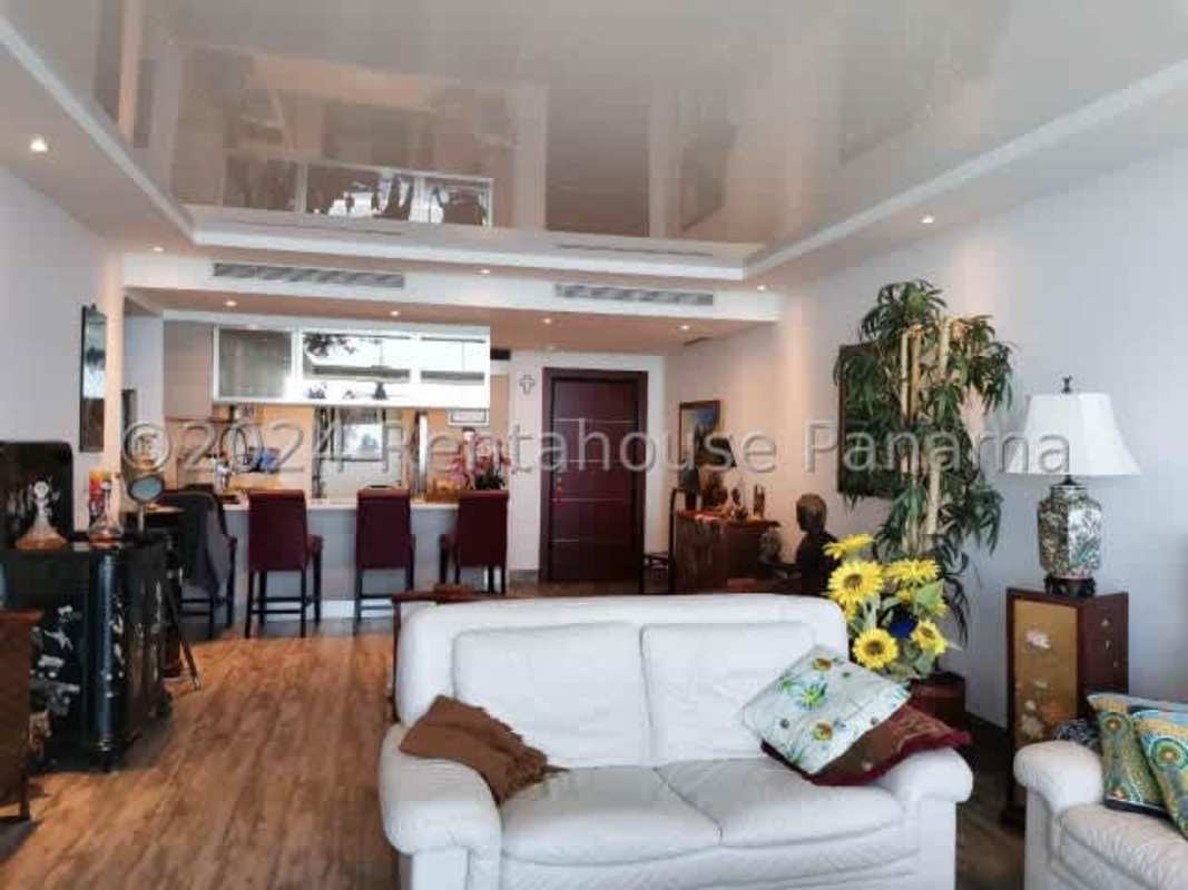 Spacious master bedroom with floor-to-ceiling windows, ocean view in luxury condo Panama