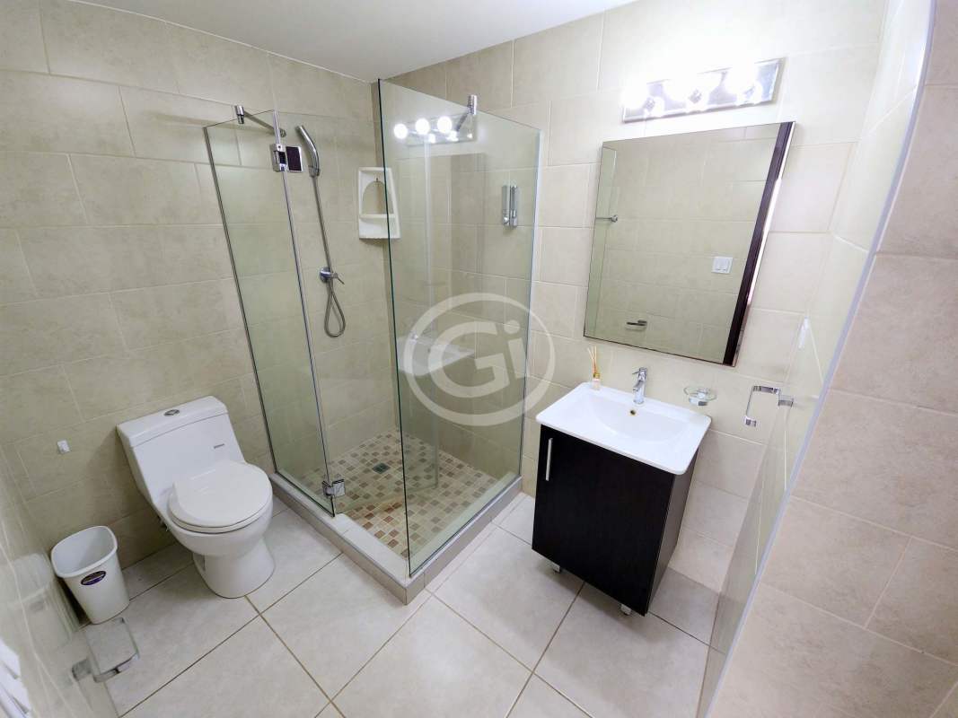 Open kitchen with granite countertop, modern appliances at PH Bay View Avenida Balboa Panama