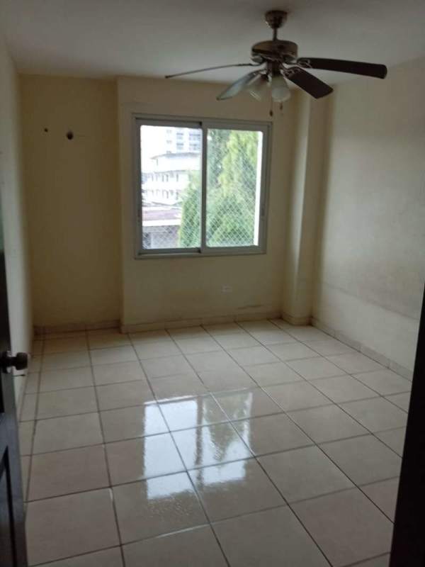 Second bedroom with ceramic floor, window and ceiling fan in PH Beyona Park Panama City
