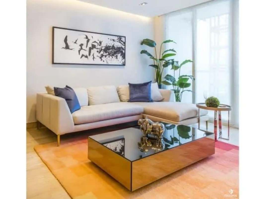 Minimalist fully furnished living space featuring panoramic city views at PH The Regent Costa del Este