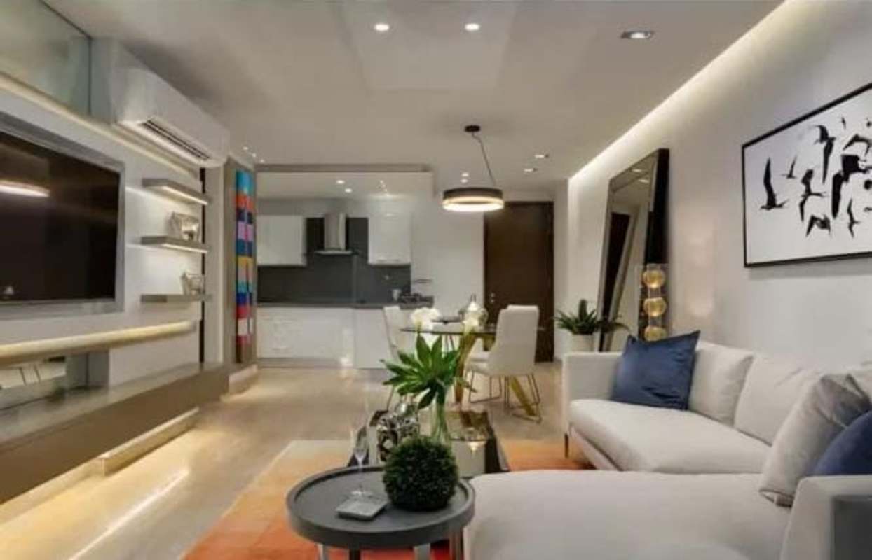 Bedroom featuring mirrored accent wall in PH The Regent Costa del Este Panama