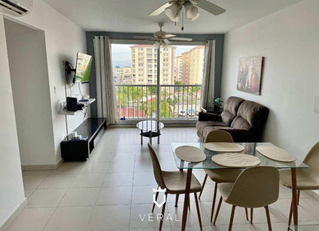 Furnished dining and living space with marble floors and balcony in PH Torres de Versalles Las Acacias Panama