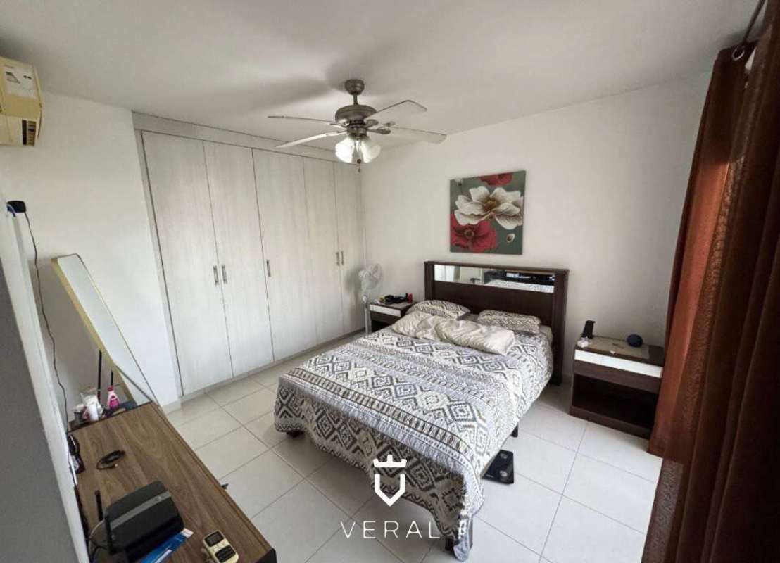 Bedroom with large wardrobes, neutral decor in PH Torres de Versalles Panama