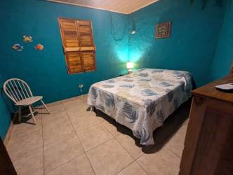 Nautical style bedroom with twin beds and AC in beachfront villa Palenque Panama