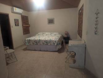 Traditional bedroom with AC and wood ceiling in Palenque Panama beach villa