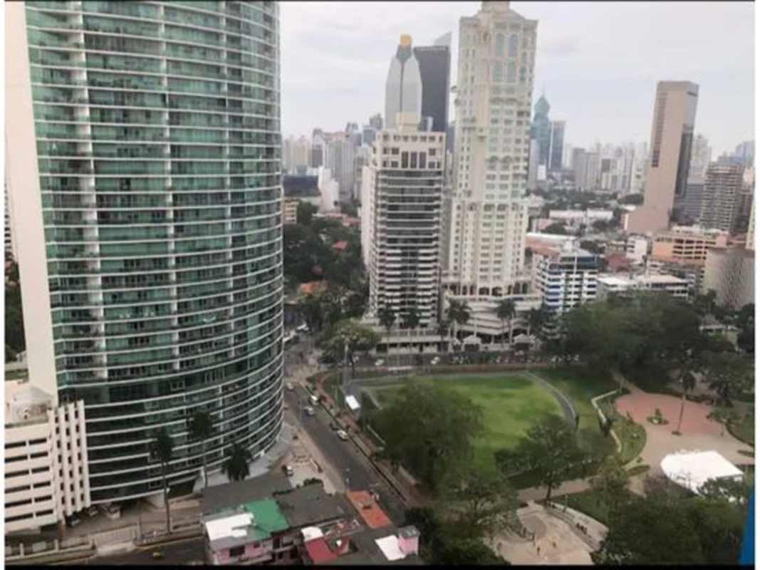 Bedroom with bed, wardrobe, AC, city view window at PH Colores Bella Vista Panama City