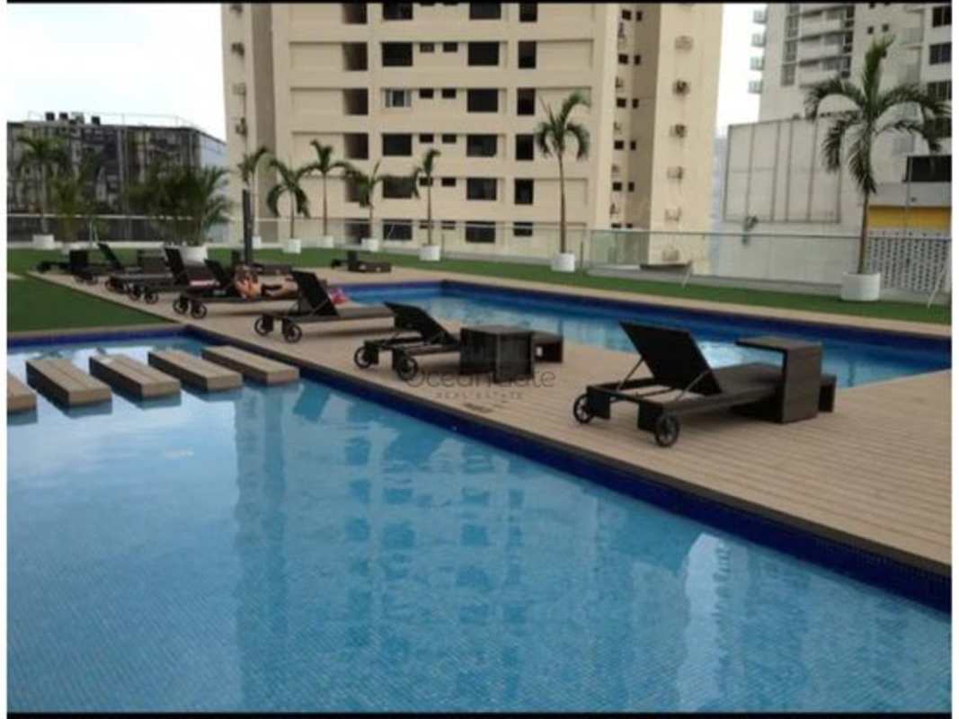 Compact modern kitchen with breakfast bar, appliances at PH Colores Bella Vista Panama