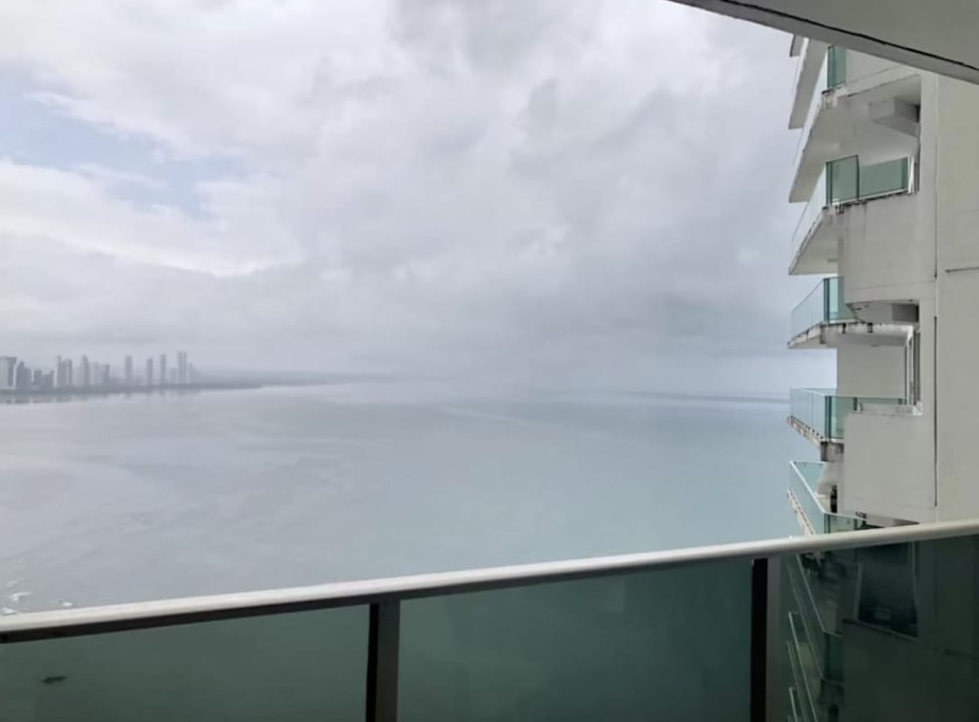 Bright living area with panoramic sea views floor-to-ceiling windows in PH Oasis Punta Pacifica Panama