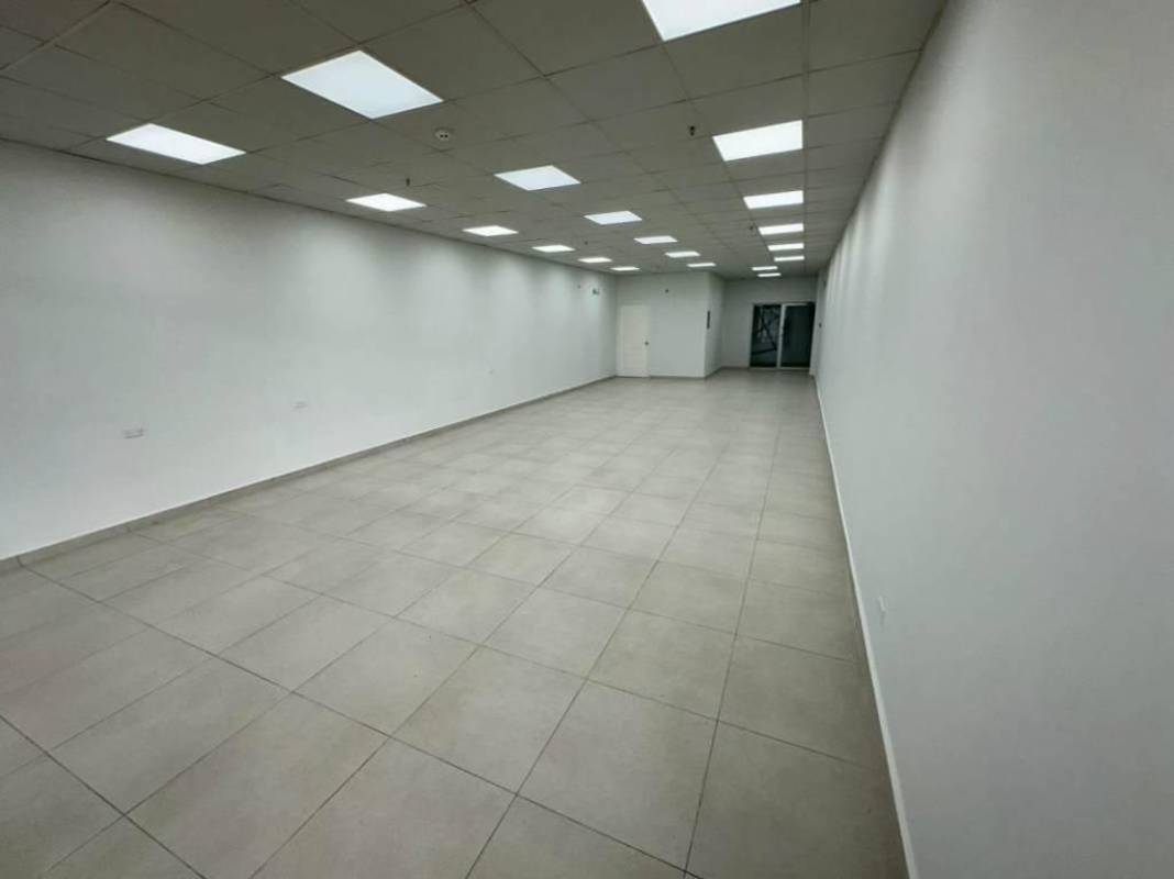 Spacious mezzanine retail or office area with tiled floor and white walls Panama City