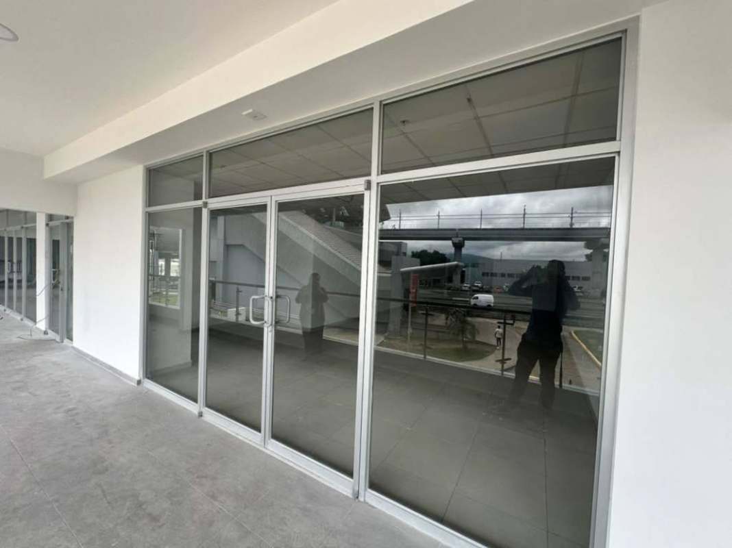 Double glass doors storefront and balcony glass railings commercial plaza Don Bosco Panama