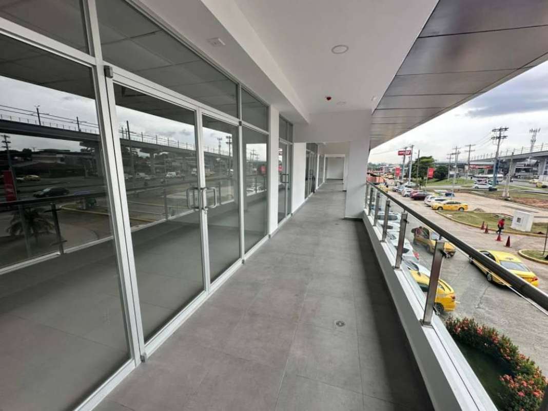 Balcony view from retail plaza overlooking street next to Metro Don Bosco Station