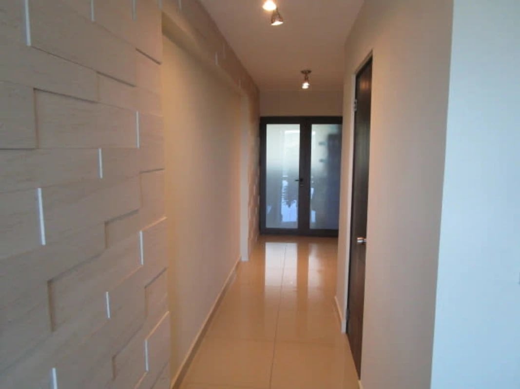 Dining space adjacent to modern kitchen with natural light at PH Pine Hill Albrook Panama