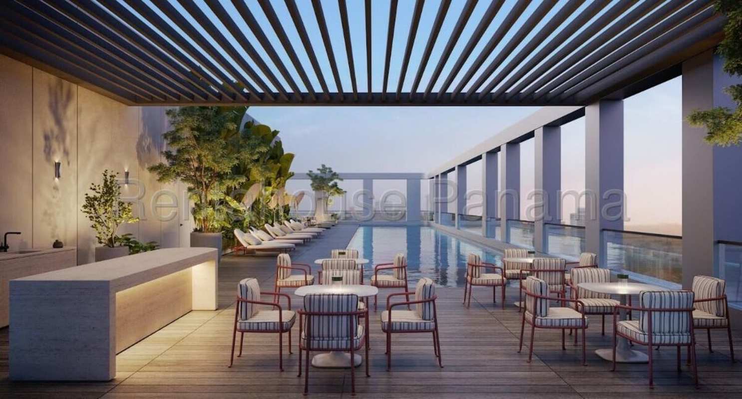 Infinity edge rooftop pool lounge seating pergola MOVA Tower Panama City at sunset