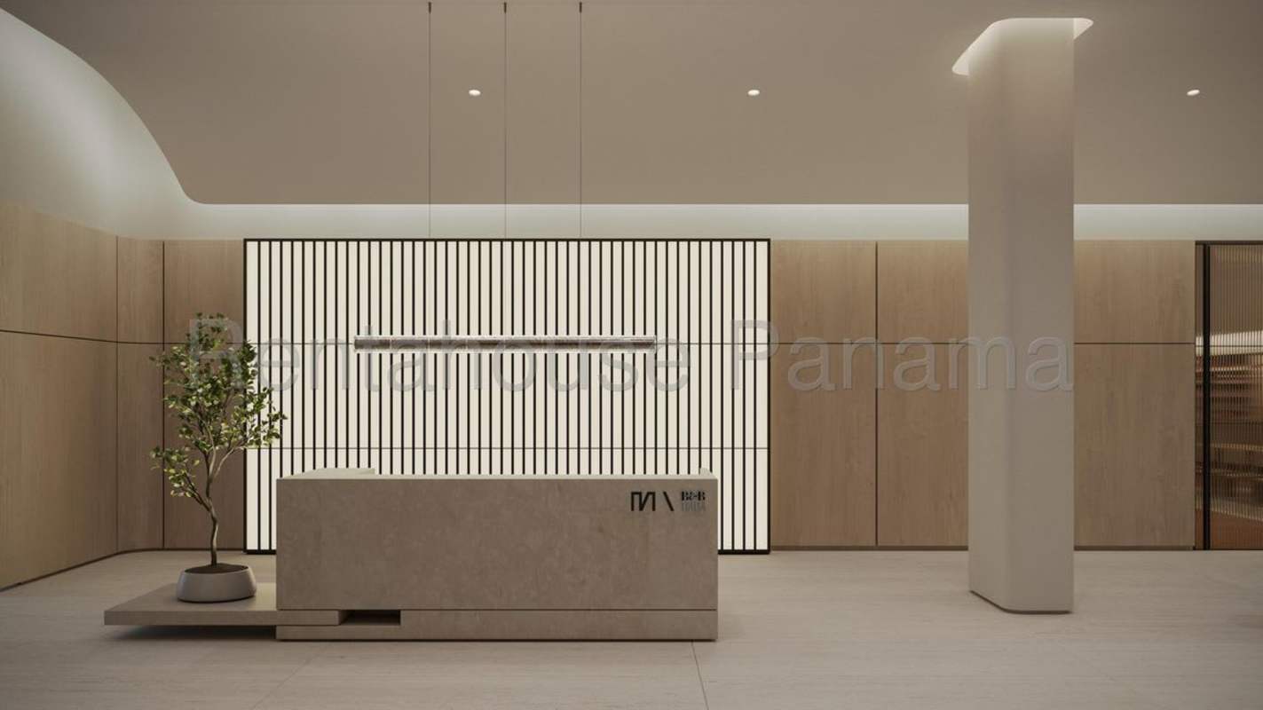Modern minimalist lobby with reception and natural finishes at MOVA Obarrio Panama