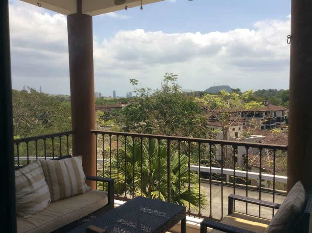 Bright master bedroom with walk-in closet, balcony access overlooking Clayton forest views in PH Clayton Forest Reserve Panama