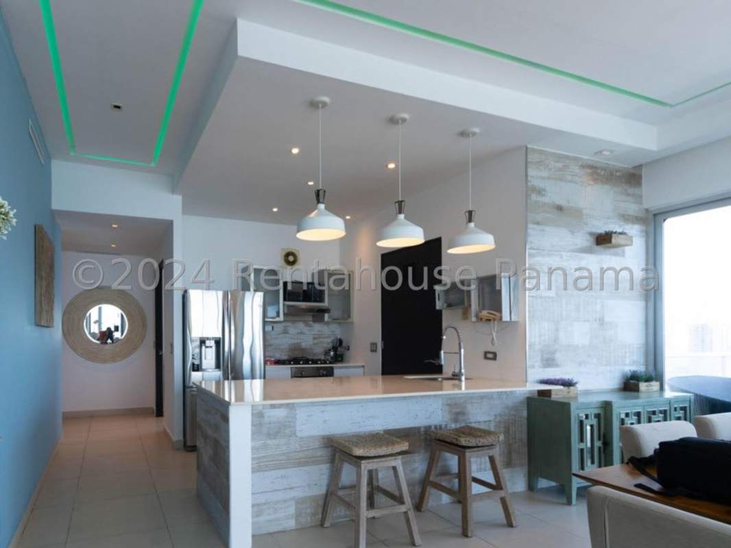 Open kitchen with granite countertops and appliances PH BICSA Financial Center Panama City