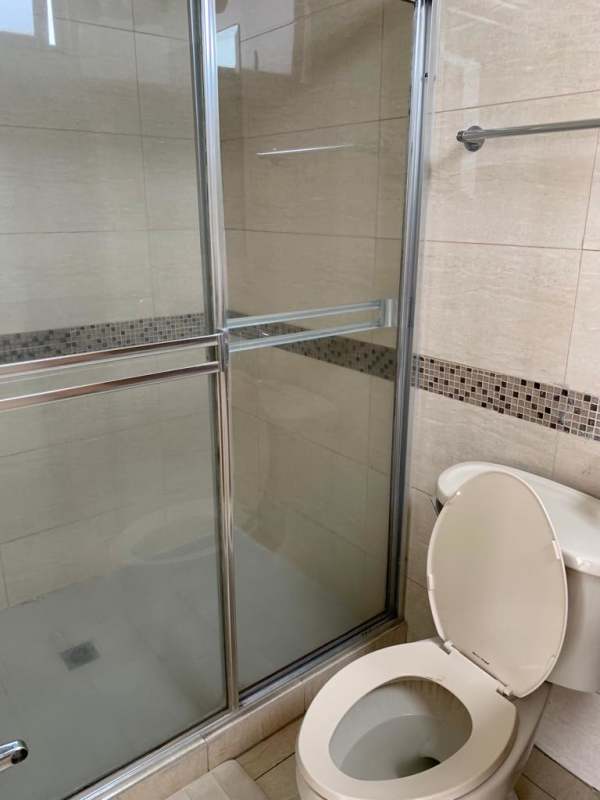 Updated bathroom with glass shower and toilet PH San Francisco Bay Panama City