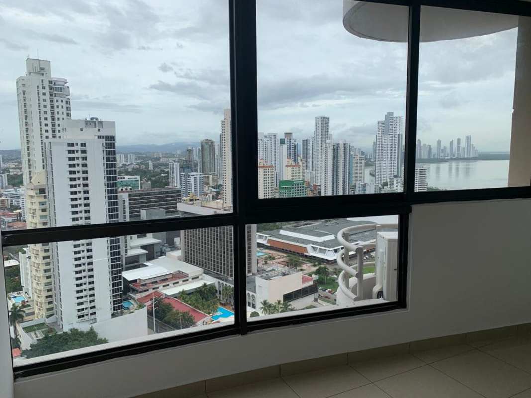 Living space with large windows offering panoramic views of Panama City from PH San Francisco Bay