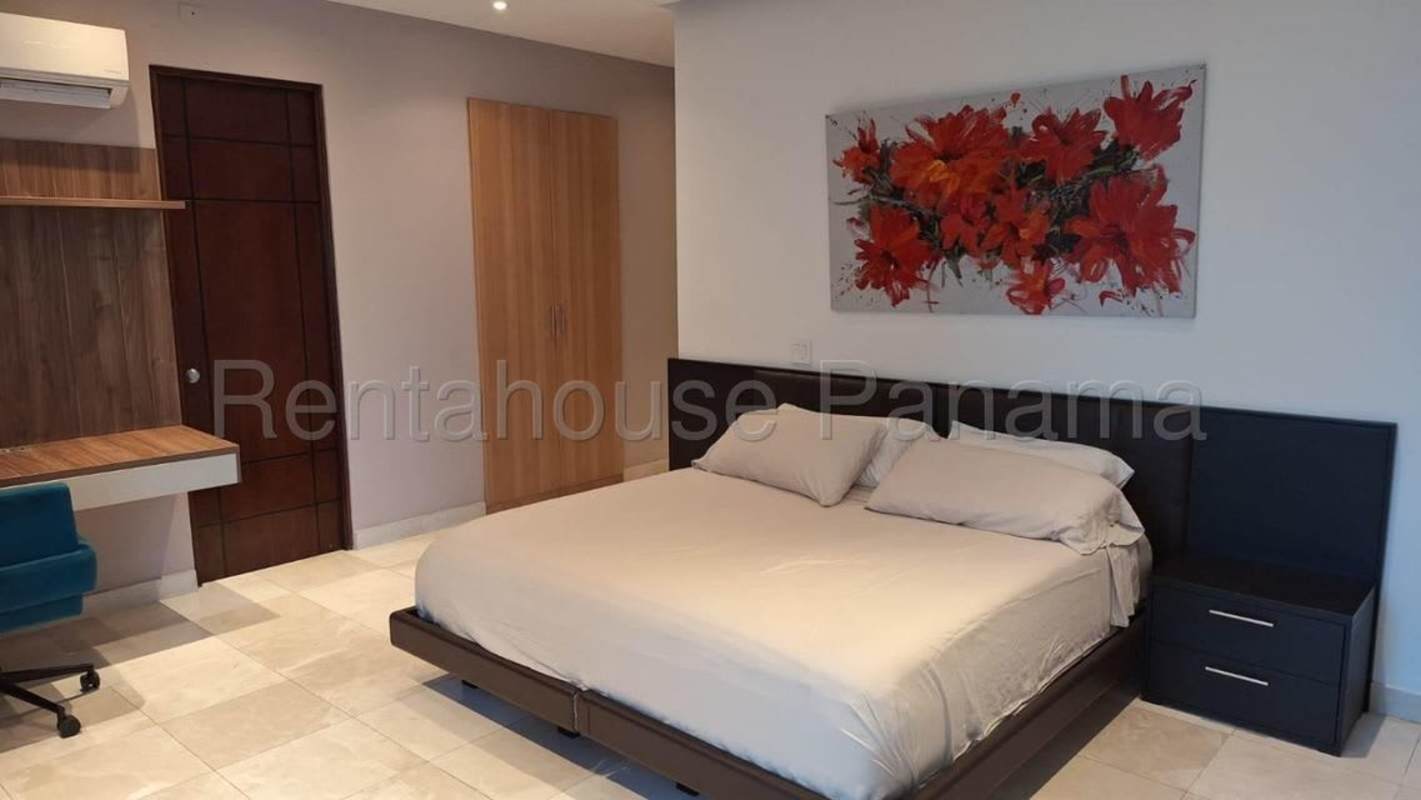 Elegant master suite with walk-in closet, large windows and ocean views at PH Pacific Village Punta Pacifica Panama