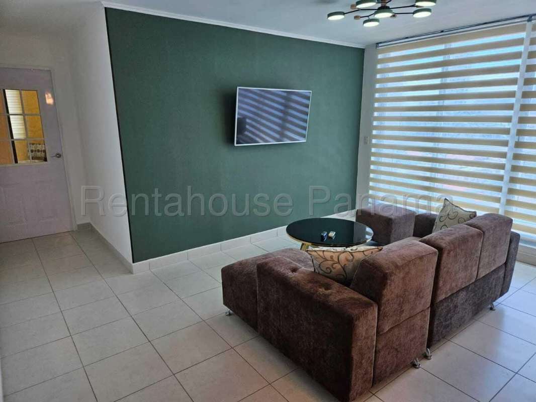 Contemporary kitchen with granite countertops and wood cabinetry in PH El Cangrejo Panama