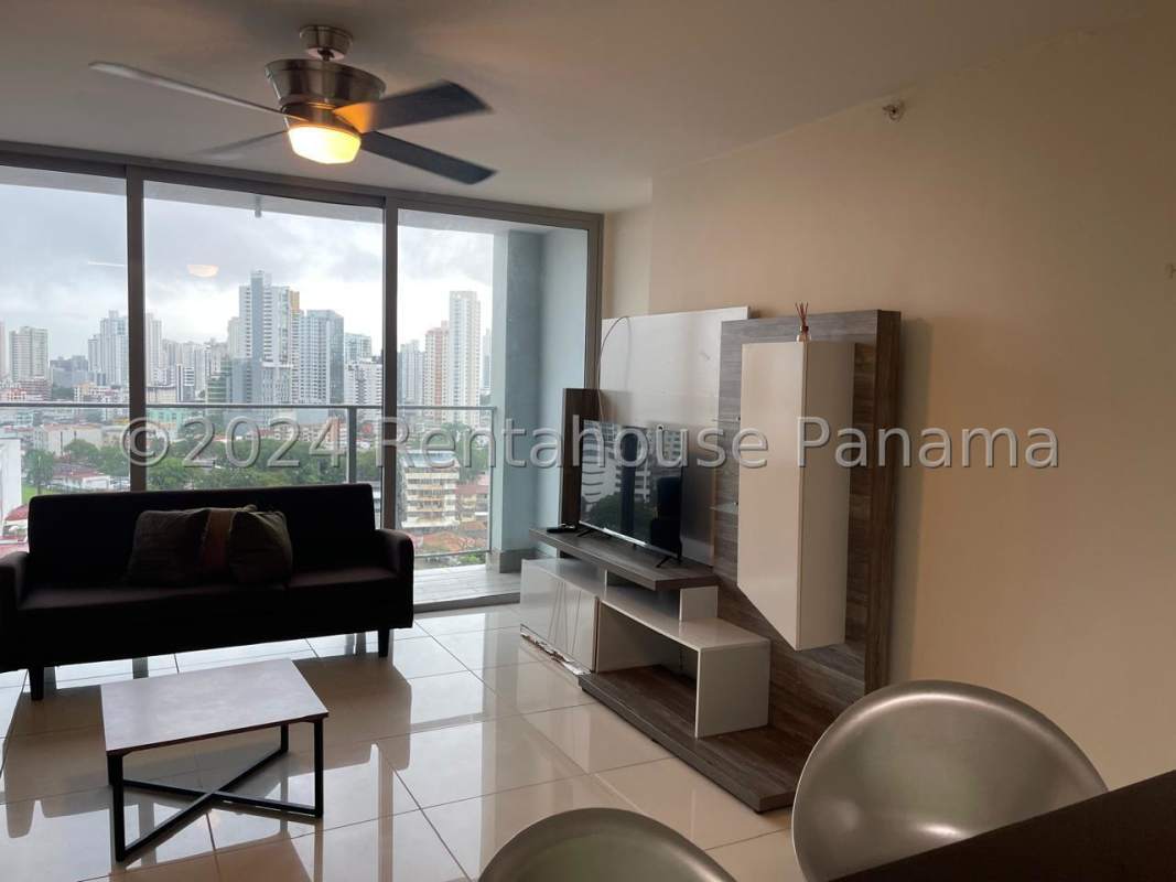 Bright open plan living dining with large windows and fan Panama