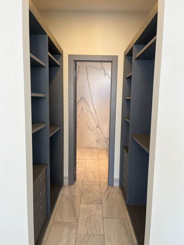 Bright secondary bedroom with built-in closets and city views in PH Nuovo Panama City rental