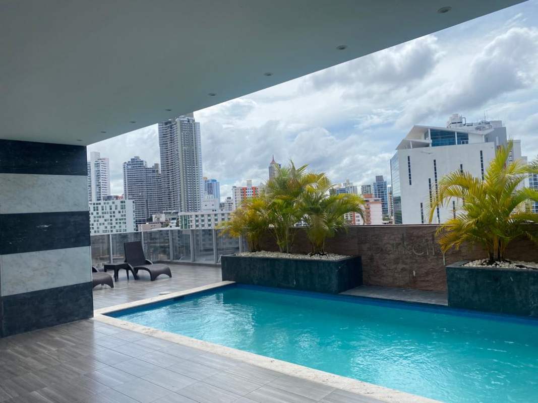 Bright corridor with tile flooring, greenery, and recessed lighting in PH Park City Obarrio Panama