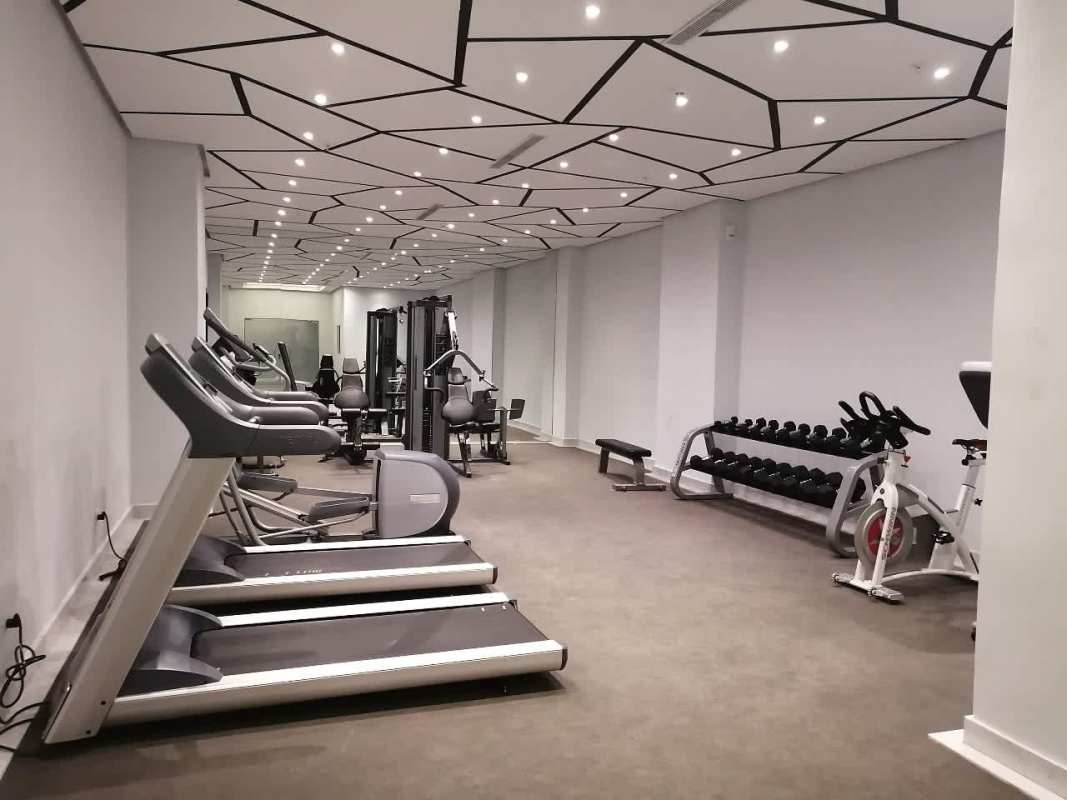 Gym with weights, treadmills, and workout machines in PH Park City Obarrio