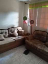 Living room with tile floor, sofas, telescope, and mountain vibe in Volcán Panama