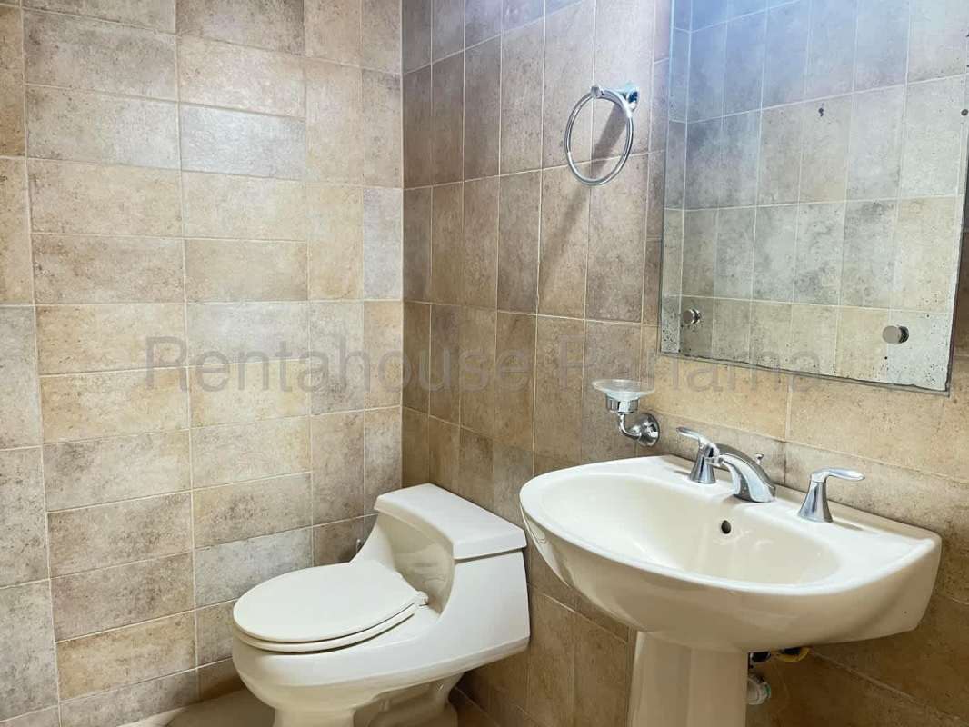 Second bedroom with ensuite bathroom, closet, and garden views Embassy Club Clayton Panama