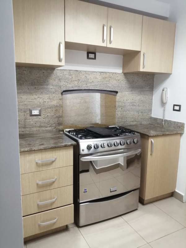 Modern kitchen area with stainless appliances and granite counters Condado del Rey Panama