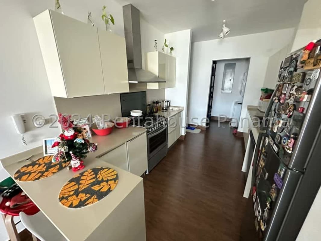 Bright open living room with city view balcony in PH Costamare Costa Sur