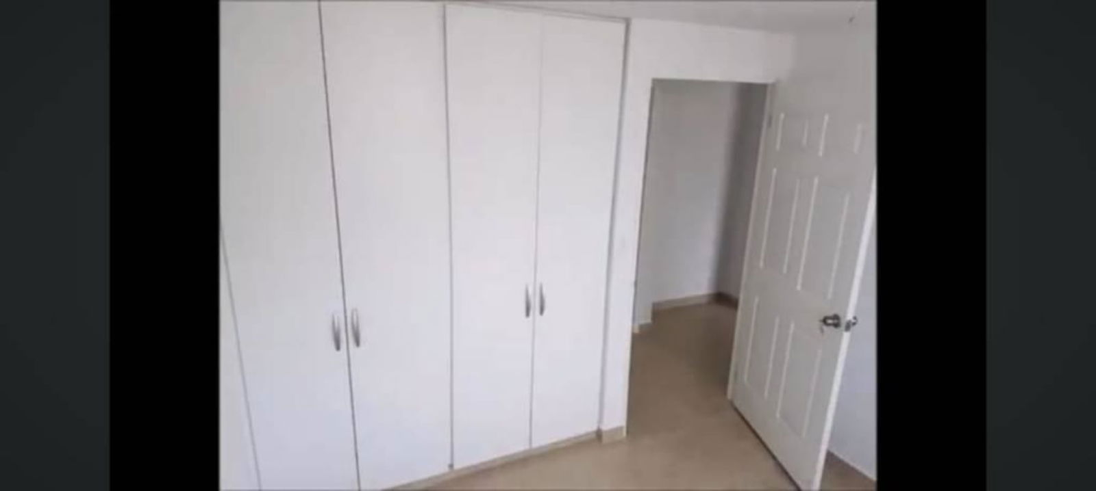 Bedroom with built-in closet white walls PH Mystic Towers Río Abajo Panama City