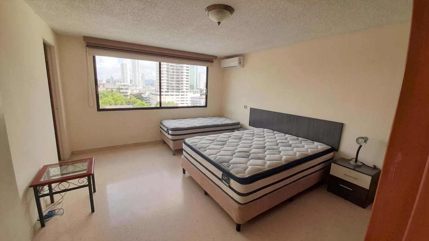 Bright living dining area with balcony access, city views, ceiling fans PH Marfil Panama