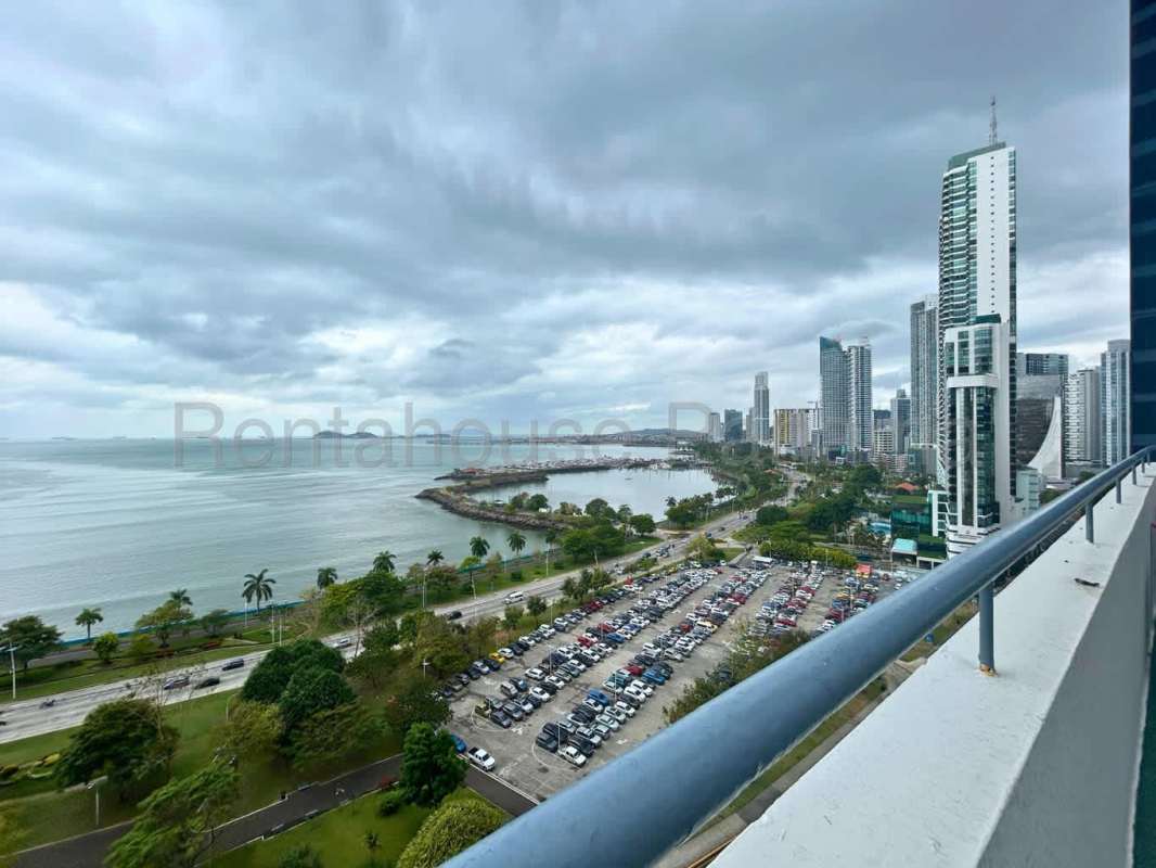 Spacious bedroom featuring large windows, wooden floors, ocean views in PH La Gaviota