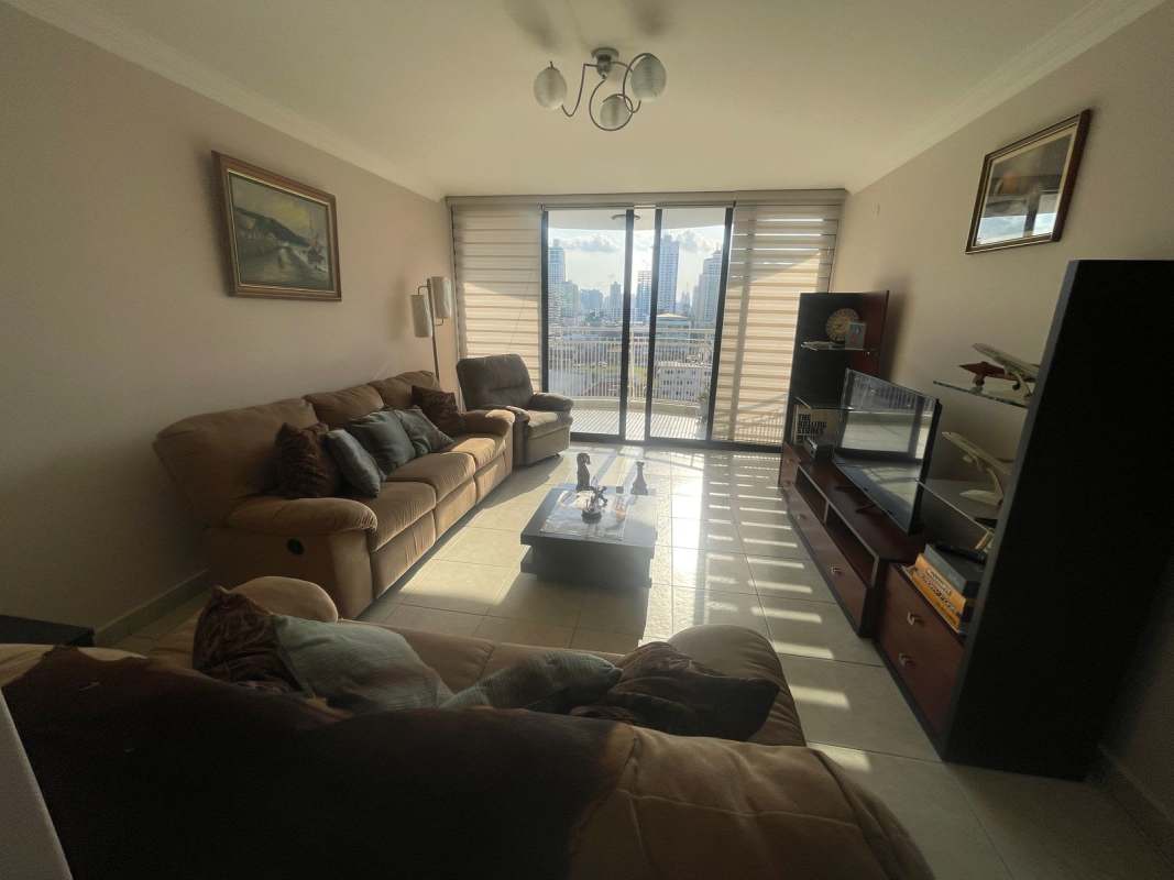 Furnished master bedroom with large window, double bed and city views in Lexus Tower San Francisco Panama City