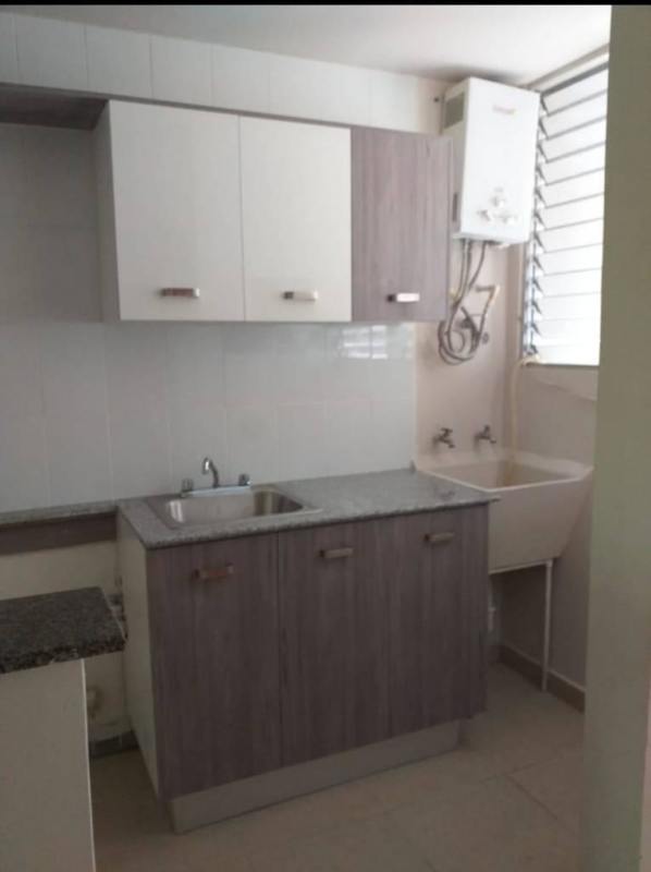 Laundry utility room with cabinets, sink and ventilation at PH Bella Vista Garden Panama