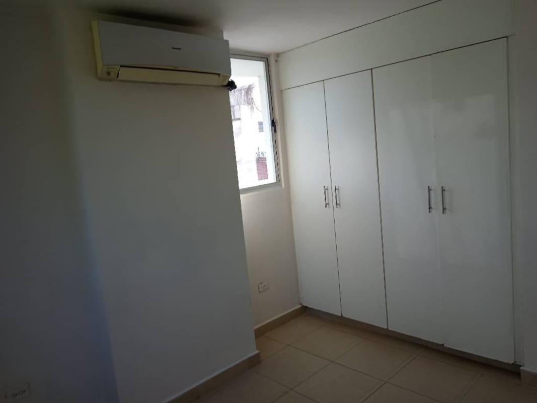 Bright bedroom with built-in wardrobe inverter air conditioner at PH Bella Vista Garden Panama