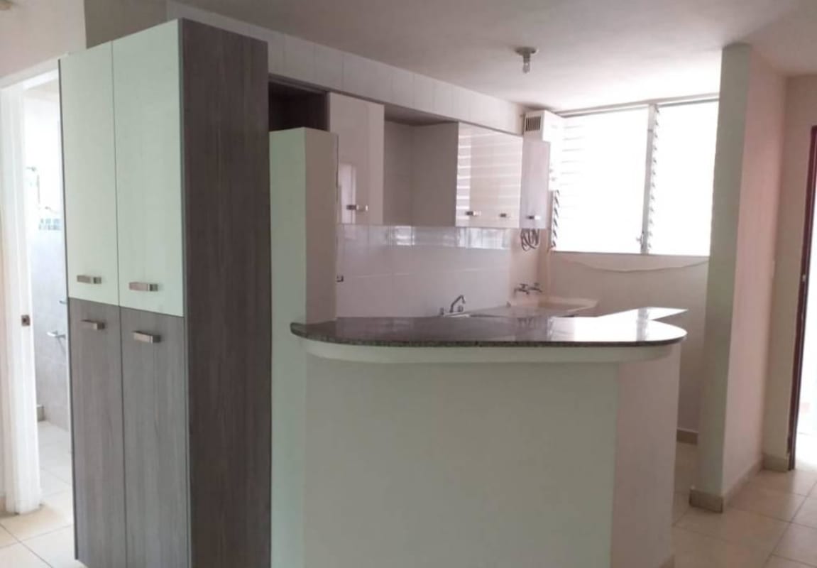 Modern kitchen with granite counters and open passthrough at PH Bella Vista Garden Panama