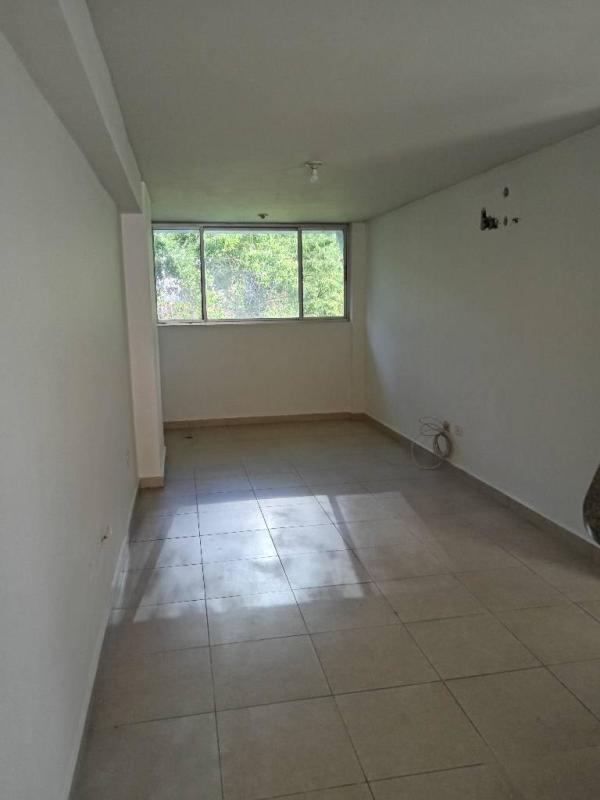 Empty minimalist living room with ceramic floor and large window PH Bella Vista Garden Panama