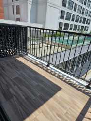 Balcony with view overlooking swimming pool in Centriqo Panama Pacifico