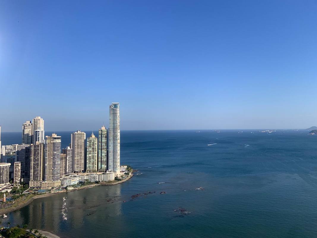 City coastal skyline with ocean and high rises near PH YOO Panama