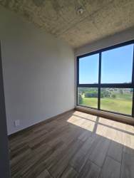 Bedroom with large window, scenic mountain view PH Centriqo Panama Pacifico